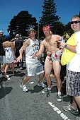 naturist participiant, ING Bay to breakers, 2007, San Francisco, every year, above age limit, naturists, body painting, running, special feeling, Gviulan, nude runner, hello, backpack, knapsack, rucksack, nude man, unswagged pair, strange pair, pair, muscular, handsome man, sunglasses, little black dress, CD 0072