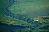 paraglide, paragliding, green, birds eye view, plan, Tokaj, map, valley, plow, field, base running jump, jumping, glider, parachute, parachutist, paratrooper, hill, hillside, countryside, nature, forest, grass, tree, river, bridge, gateway, barrier, bar, curve, bend, engine-house, strong current, electricity, wire, dangerous, water, arable, clod, earth, ploughland, tillage, meadow, range, pasture, grazer, parking, near, past, tower, television, bushes, trees, mountain, touch-down, to climb down, landing, to circle round, to lift off, to the left, thermic, yellow, to the right, down, up, clearing, glade, running leap, run up to, heater, headwind, wind, eye, front of, blow, lifting, brave, sport of the brave, sport, evening, sunset, sky, lake, lakes, behind we legs, cut-off lands, tables, agriculture, agricultural land, road, car, house, shed, grapes, vineyards, vineyard, critter, haze, steam, vapor, fog, hardy, spare-time, leisure, time, Kiss Lszl, Lszl Kiss