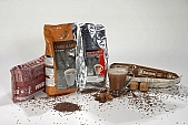 coffee, coffee box, packet, packing, household, drink, dust, chocolate, hazel, hazelnut, nut, walnut, cup, spoon, spoons, metal, metallic, aluminium, shiny, glass, crome, nickel, stainless, bitter, uscious, sweet, balmy, fragrant, redolent, steamy, reeking, blink, gleam, vacuum, packed, instant, gold, silver, gran, granulated, coffee color, drab, brown, milk, white coffee, coffee beans, Kiss Lszl, Lszl Kiss